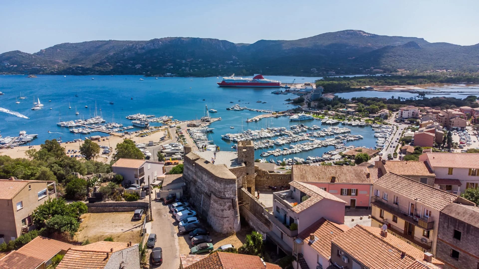 Aerial view of Bastion de France citadel, Porto Vecchio marina, and Mediterranean sea in South Corsica.